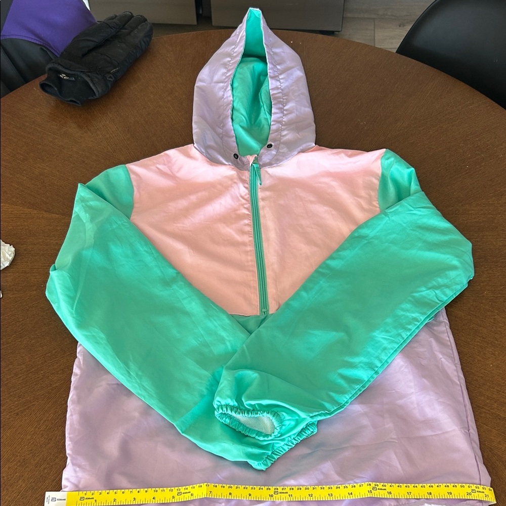 Multicolored windbreaker jacket. Never worn, unsure of the brand.Great condition